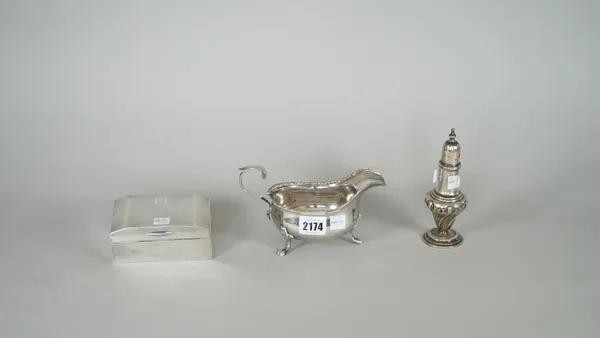 Silver and silver mounted wares, comprising; a sauceboat, decorated with a beaded rim, with a scrolling handle, raised on three feet, Sheffield 1925,