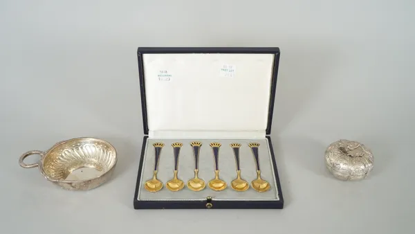 A set of six Danish silver gilt and blue enamelled coffee spoons, detailed Ela Denmark Sterling 925 S, with a case, a shaped circular box, with a deta