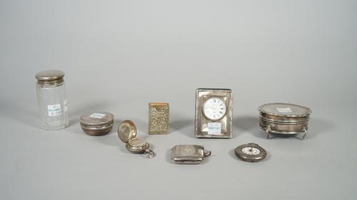 Silver and silver mounted wares, comprising; a late Victorian sovereign case, Birmingham 1896, a curved rectangular vesta case, Birmingham 1928, an ov
