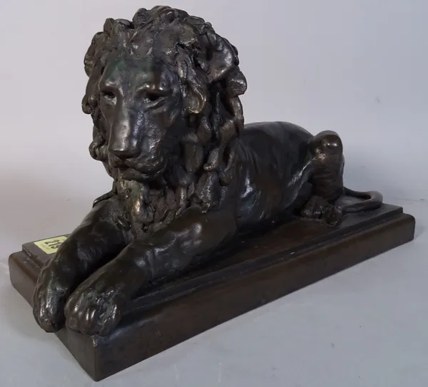 Ronald Moll limited edition bronzed figure of recumbent lion on rectangular base, signed and numbered 71/750 (height 18cm length 32cm), a black slate