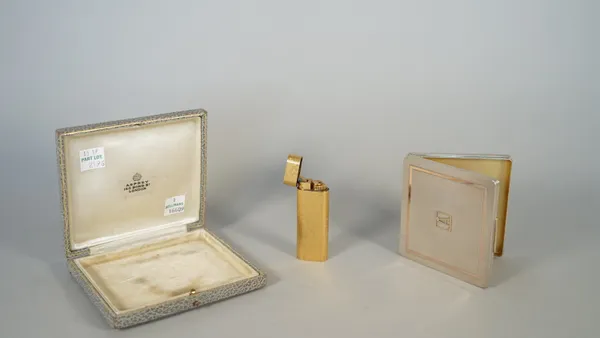 A silver and gilt highlighted rectangular cigarette case, gilt within, the exterior engine turned and applied with the initial A, London 1936, weight