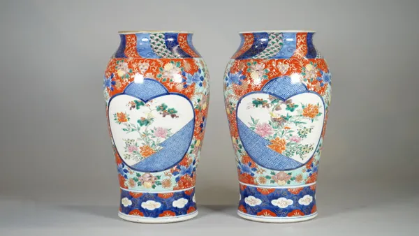 A pair of late 19th century Japanese Seto ware vases, with character marks to bases, 32cm high, (2).