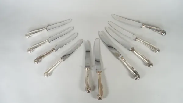 Twelve steel bladed cheese knives, with pistol grip silver handles, Sheffield mixed dates and twelve steel bladed table knives, with pistol grip silve