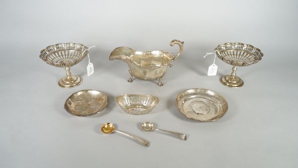 Silver, comprising; a pair of pedestal bonbon dishes, having pierced decoration below shaped circular rims, Birmingham 1920, a sauceboat decorated wit