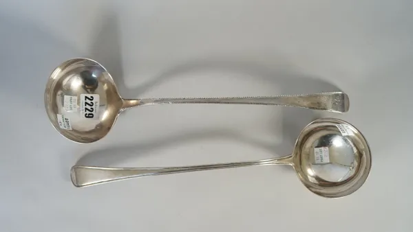 A George III silver bottom marked, feather edged, Old English pattern soup ladle, circa 1790 and a George III single struck, Old English and thread pa