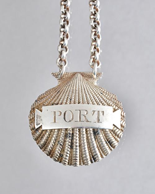 A George III silver decanter label, detailed Port, modelled as a scallop shell, probably London 1808, maker Benjamin Smith II & James Smith III, weigh