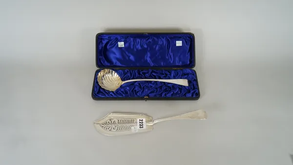 A silver Old English pattern fish slice, with pierced decoration, London 1824 and a silver Old English pattern soup ladle, having a spiral decorated s