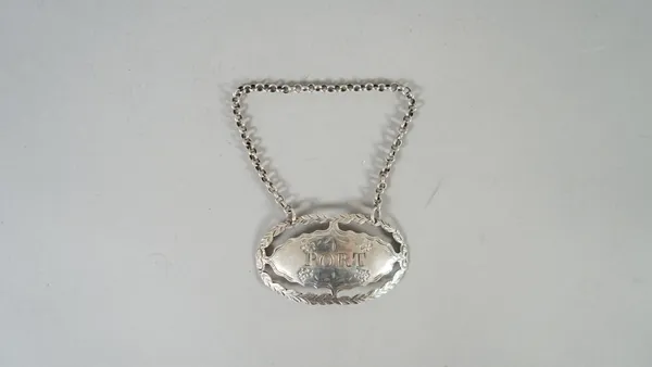 A silver decanter label, detailed Port, of oval form, with pierced and engraved decoration, struck with the maker's mark only for Hester Bateman, circ