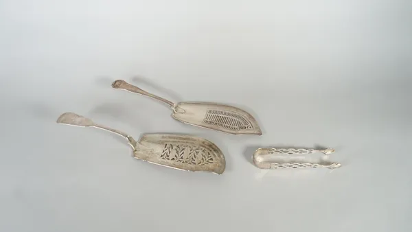Silver, comprising; a George IV fiddle pattern fish slice, pierced and engraved with three fish, otherwise decorated with a foliate spray, London 1828