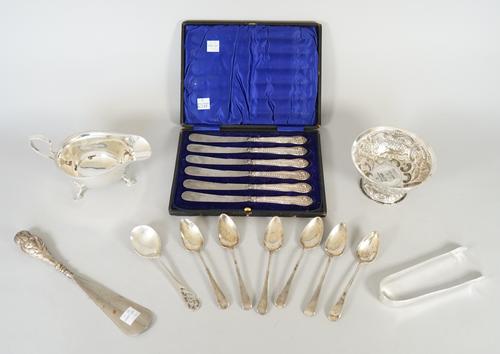 Silver and silver mounted wares, comprising; a sauceboat, with a scrolling handle, raised on three feet, Sheffield 1932, six tea knives, having loaded