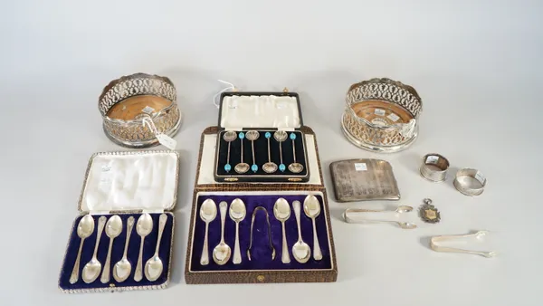 Silver, comprising; a set of six teaspoons, Birmingham 1942, with an associated pair of sugar tongs, Birmingham 1924, with a case, two further sets of