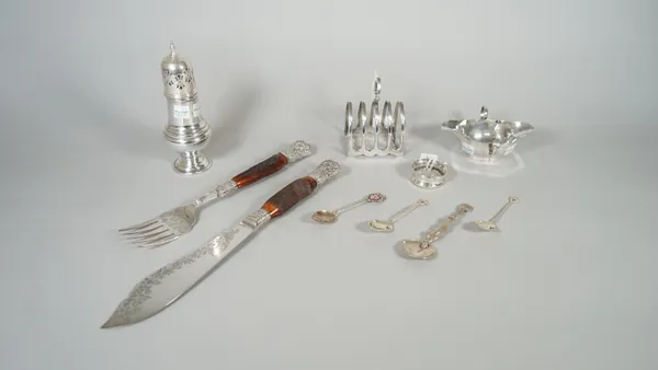 Silver, comprising; a five bar toast rack, with a loop shaped handle, Sheffield 1955, a twin handled sauceboat, Sheffield 1907, a napkin ring and two