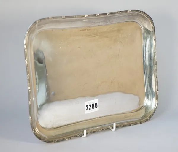 A silver rectangular dressing table tray, having a decorated border, Birmingham 1916, 30cm x 21.5cm, weight 485 gms.