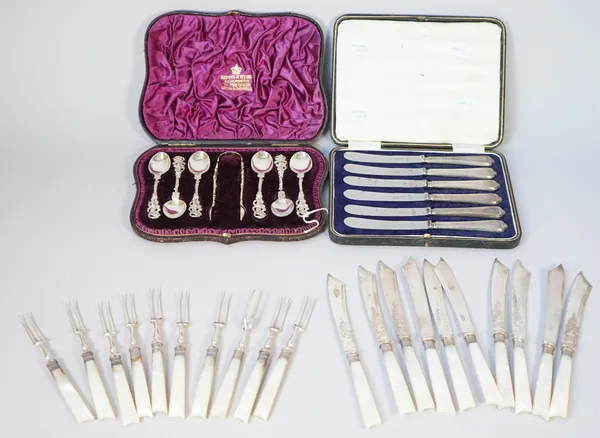 A set of six Victorian silver teaspoons, the handles with cast and pierced decoration and with figure terminals and a matching pair of sugar tongs, Lo