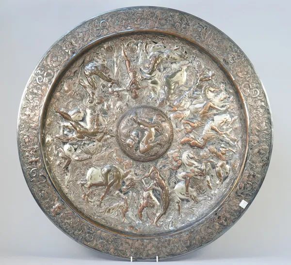 An Elkington silver plated on copper model of The Shield of Achilles, decorated with mythological figures and animals within a wide foliate rim, detai