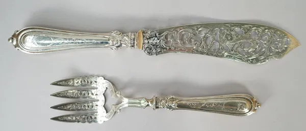 A pair of Victorian silver fish servers, each with pierced and engraved decoration and with loaded silver handles, Birmingham 1851, gross combined wei