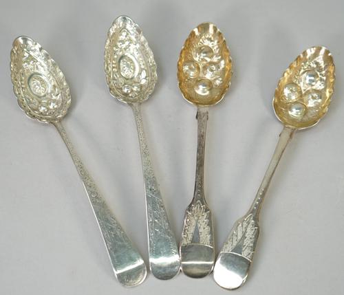 A pair of Scottish silver berry spoons, with later embossed and engraved decoration, Edinburgh probably 1808 and a pair of Victorian silver fiddle pat