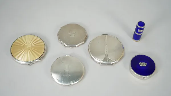 A lady's silver and buff coloured enamelled powder compact, Birmingham 1939, three lady's silver powder compacts, having enamelled decoration, a lady'