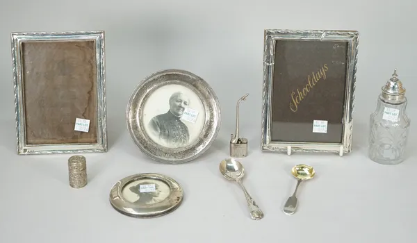 Silver and silver mounted wares, comprising; a pair of photograph frames, having decorated borders, Birmingham 1922, two circular photograph frames, a