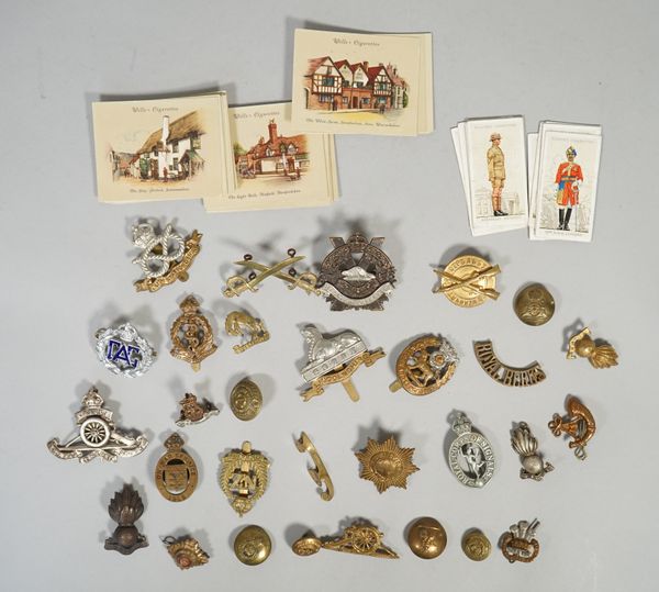 A small group of mostly militaria, comprising; twenty-three badges, includin; cap and collar badges (may include some re-strikes), six uniform buttons