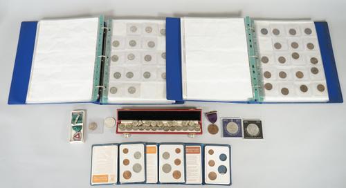 A collection of British pre-decimal coins, displayed in an album, comprising; threepences, sixpences, shillings, florins and half crowns, including pr
