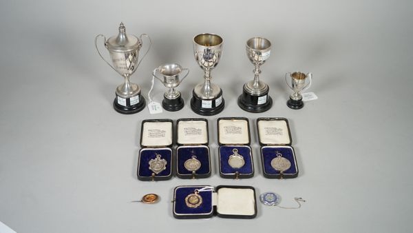 A group of motor cyling awards to D.McNeil, comprising; a 9ct gold and blue enamelled fob medal, detailed Axe Vale Motorcycle & Light Car Club 6-6-29