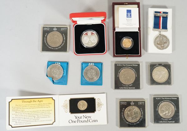 An Elizabeth II proof sovereign 1996, with a Royal Mint case, a 1935 Silver Jubilee crown, six various Elizabeth II commemorative crowns, a silver pro