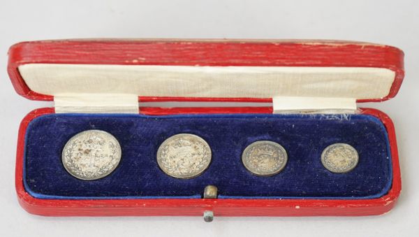 A George V four coin maundy money set, 1931, with a red case detailed 'MAUNDY MONEY'.