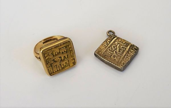 An Indian gold square coin, in a later 9ct gold mount as a ring, Birmingham 1972, weight 14 gms, ring size N and an Indian silver square token, mounte