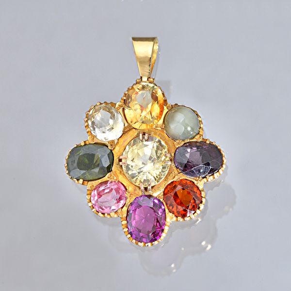 A gold and varicoloured gemstone set nine stone pendant, the gemstones including various coloured sapphires, a garnet and a cat's eye, gross weight of