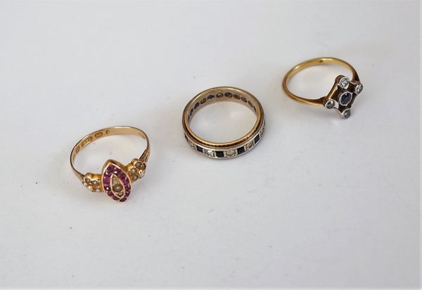 A Victorian 15ct gold, ruby and seed pearl set marquise shaped cluster ring, with flowerhead shaped shoulders, Birmingham 1874, a gold and platinum ri