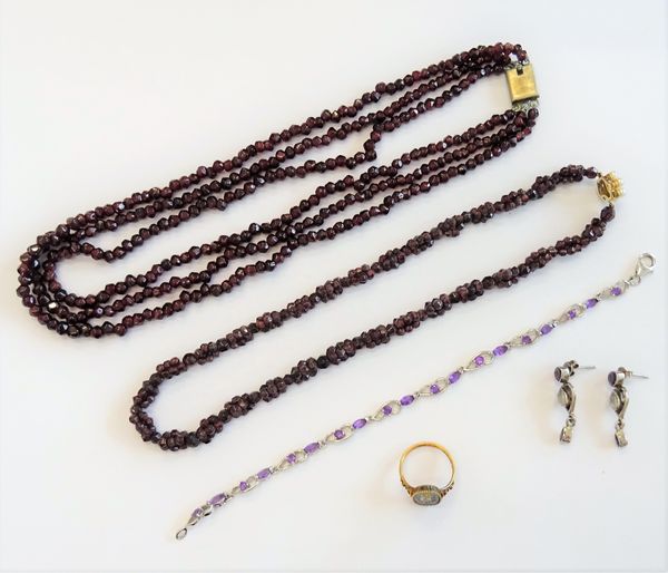 An oval Florentine micro-mosaic ring, in a floral design, ring size K, two garnet bead necklaces, a silver and amethyst bracelet, detailed 925 and a p