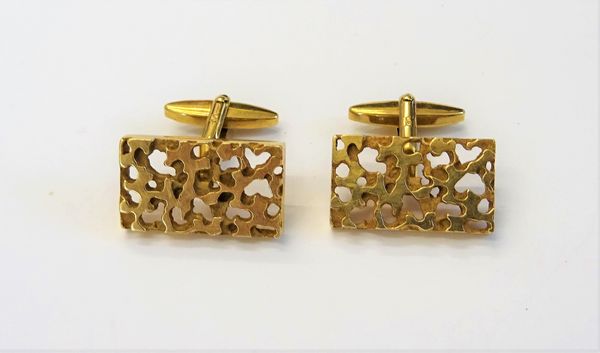 A pair of 9ct gold cufflinks, each with a rectangular front, having cast and pierced decoration and with folding bar fittings at the backs, import mar