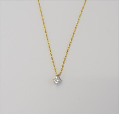 A diamond set single stone pendant, mounted with a circular cut diamond, with a 9ct gold multiple link neckchain, on a boltring clasp, (2).
