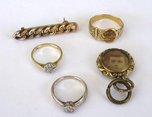 A 9ct gold and diamond seven stone cluster ring, mounted with circular cut diamonds, a white gold and diamond cluster ring, with diamond set shoulders