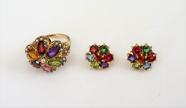 A pair of 18ct gold and varicoloured gemstone set seven stone cluster earstuds, including garnet, amethyst and peridot, the backs with post and butter