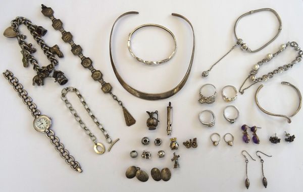 Mostly silver jewellery, comprising; a curb link charm bracelet, on a heart shaped clasp, four further bracelets, an Accurist bracelet wristwatch, two