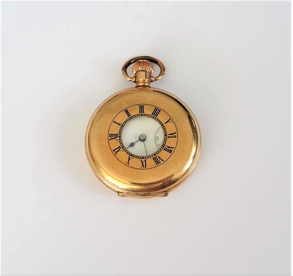 A gilt metal cased, keyless wind, half hunting cased gentleman's pocket watch, the gilt three quarter plate lever movement detailed Thos Russell & Son