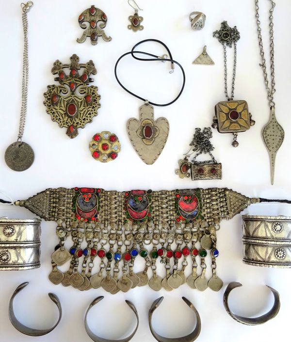 A collection of Asian jewellery, comprising; a necklace with pendant coins, five pendant necklaces, a pair of bangles, four further bangles, three pen