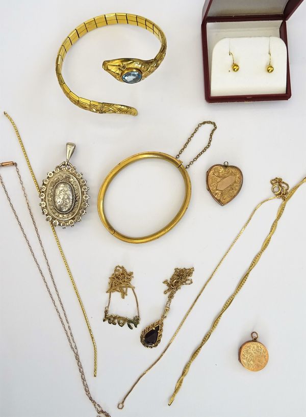 A collection of gold and costume jewellery, comprising: a 9ct gold and red paste set pendant of drop shaped design, suspended from a yellow metal trac