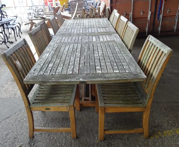 Westminster Teak; a 20th century extending garden table, 204cm long x 86cm wide 296cm fully extended x 74cm high together with a set of ten matching c