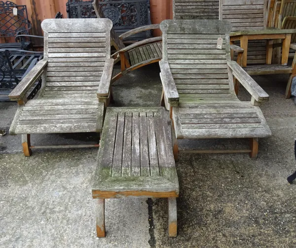 Garden furniture comprising; a pair of teak low armchairs, 75cm wide x 85cm high and a matching rectangular low table, 91cm wide x 36cm, (3).