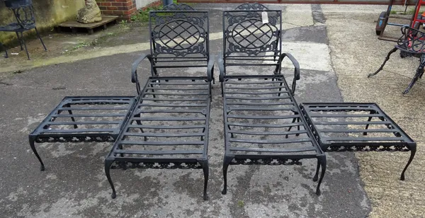 Forecast Furniture LTD;  a pair of black painted metal sun loungers, 180cm long x 81cm high and a pair of matching side tables, 57cm wide x 32cm high,