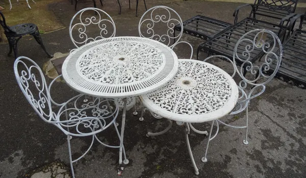 A set of five 20th century white painted wire work open armchairs, a similar circular garden table, 80cm diameter x 68cm high and another smaller tabl