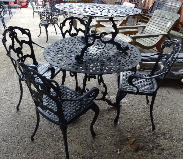 A set of four 20th century black metal garden chairs to include two carvers, an associated circular garden table, 90cm diameter x 75cm high and a smal