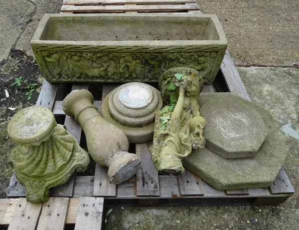 A rectangular reconstituted stone planter decorated with cherubs, 100cm wide x 31cm high and a group of four reconstituted stone bases, the largest 50