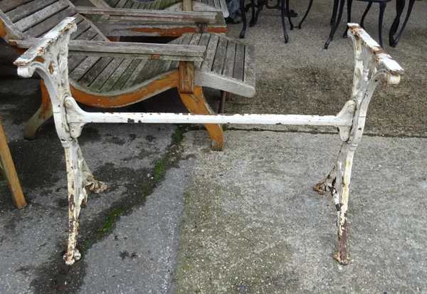 A late Victorian white painted cast iron table base, top lacking, 99cm wide x 69cm high.