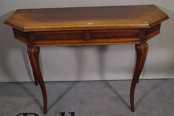 A 20th century oak console table on scroll supports, 123cm wide x 81cm high.