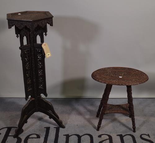 An early 20th century Burmese carved hardwood jardinière stand with octagonal top on three outswept supports, 36cm wide x 98cm high and a similar carv