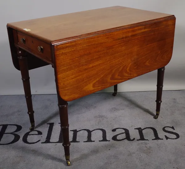 A Regency mahogany Pembroke table on ring turned support, 87cm wide x 74cm high.